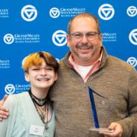 Dr. Stabler posing with kid